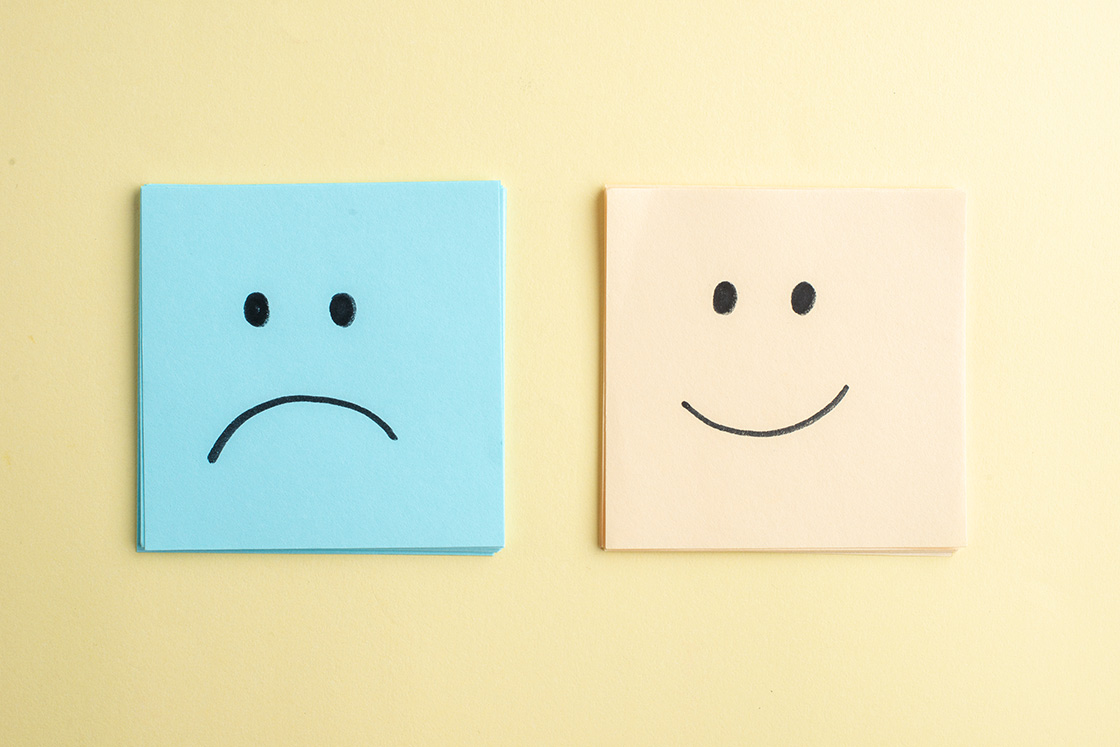 Close up of Sad and Smiling Emojis