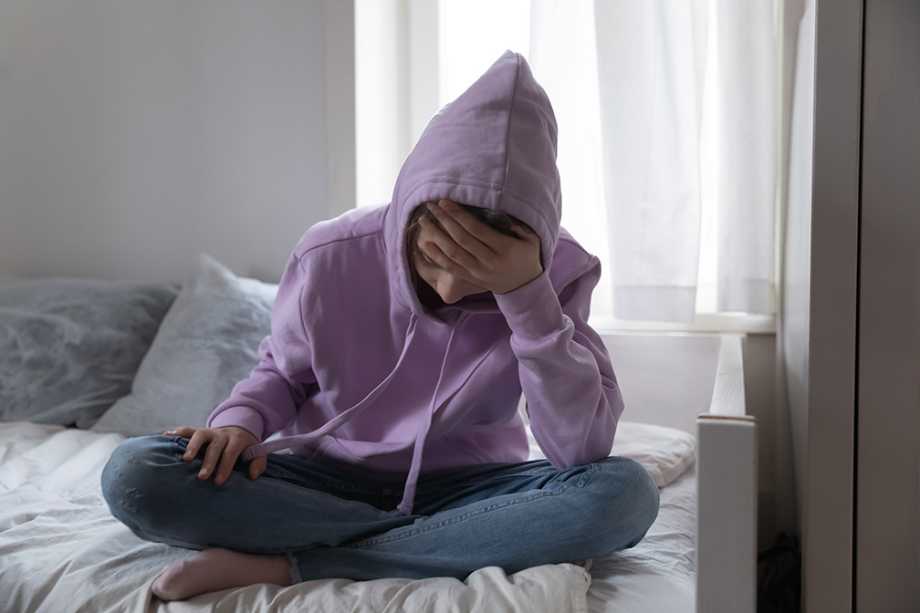 Teen Girl stressed on Bed